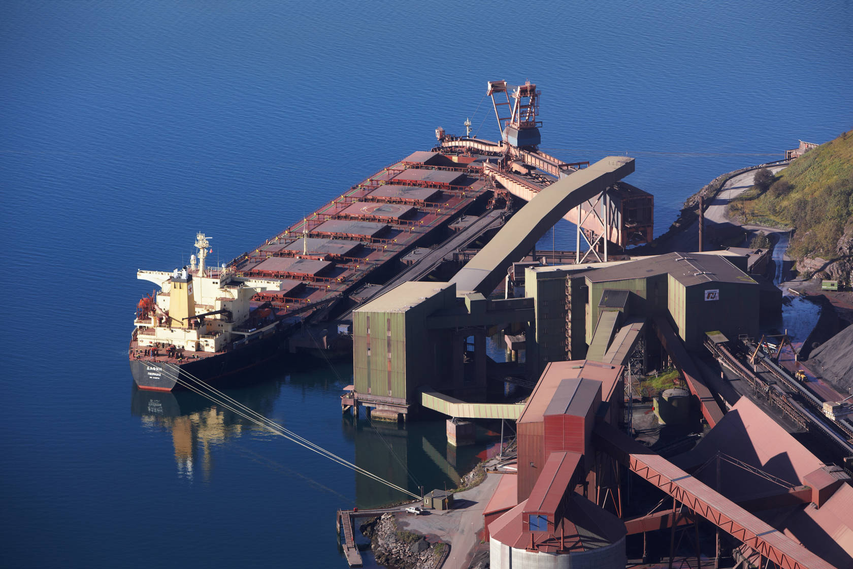 Inside the ship loaders, conveyor belts transport bulk cargo from land to ship.
