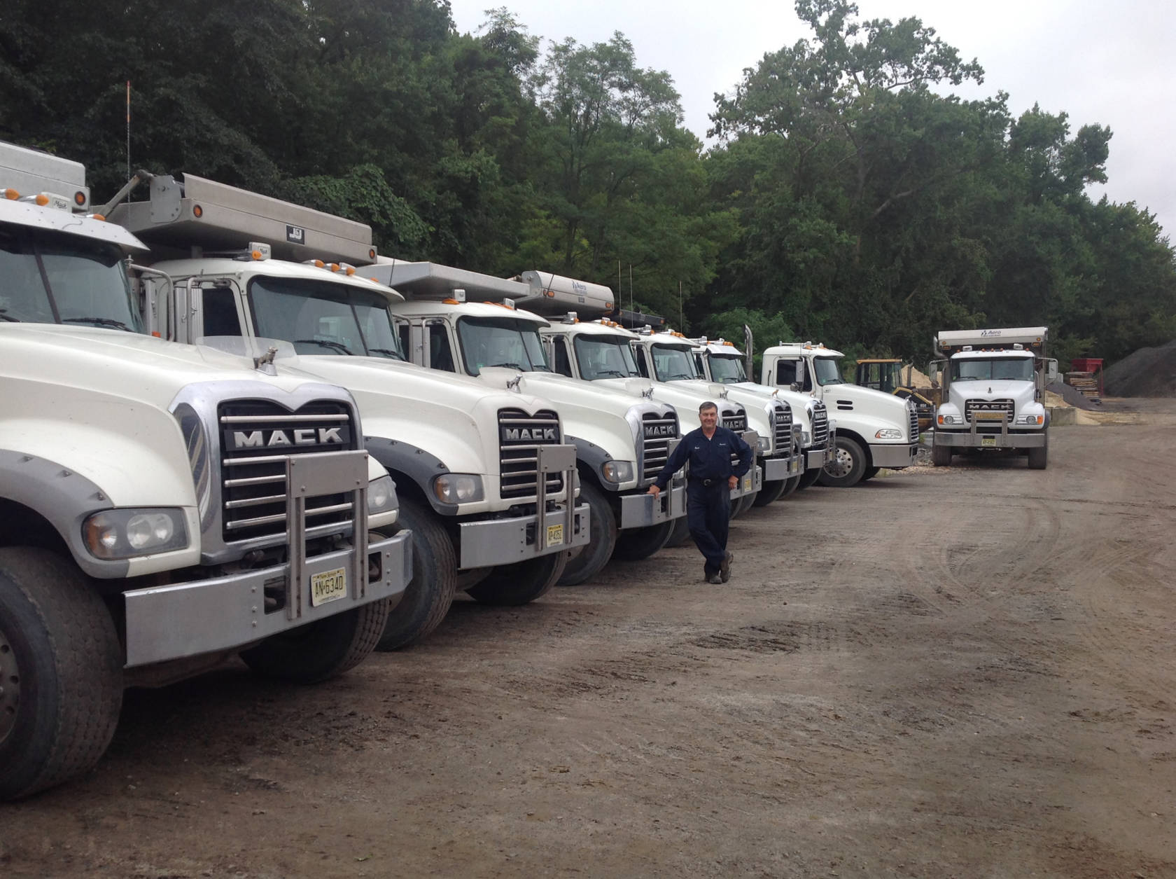 Bruce Stelljes with part of this fleet at the truck yard in Wrightstown, New Jersey.