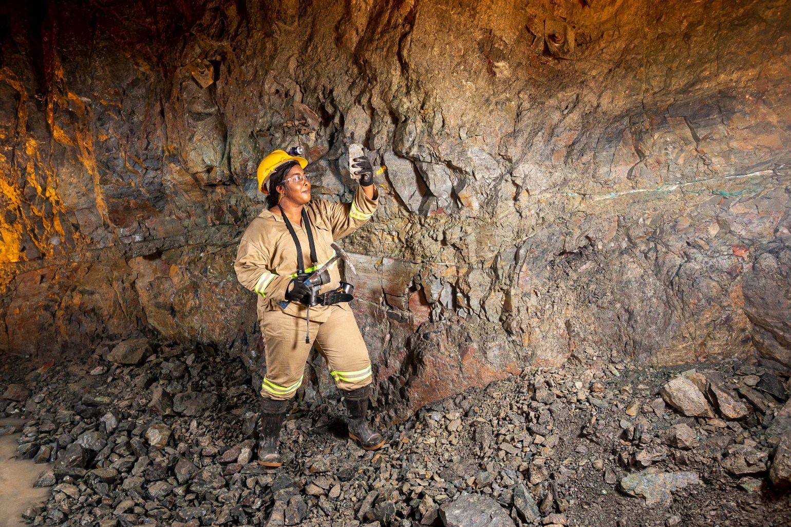 Mine geologist Micheline Kyenge examining the initial high-grade copper ore